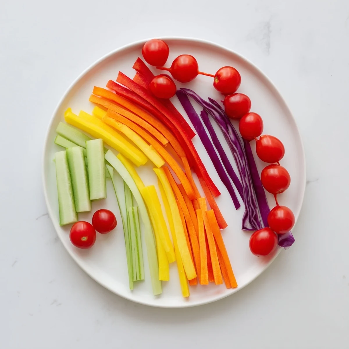 Vibrant Rainbow Arch Bright Veggie Sticks: Colorful bell peppers, carrots, and cucumbers presented as a refreshing appetizer.