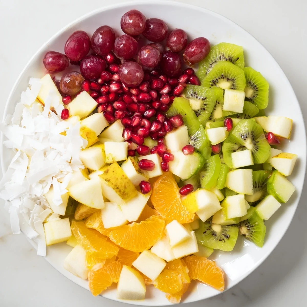 Brightly colored Snowflake Fruit Medley, tossed in citrus dressing, perfect winter fruit salad.