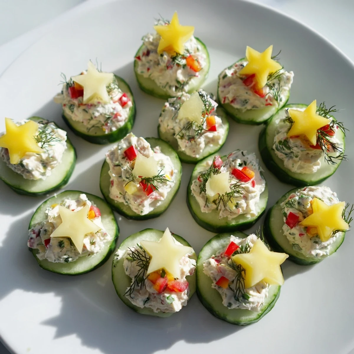 Cool, refreshing close-up of Holiday Star Cucumber Bites with creamy filling and colorful toppings.