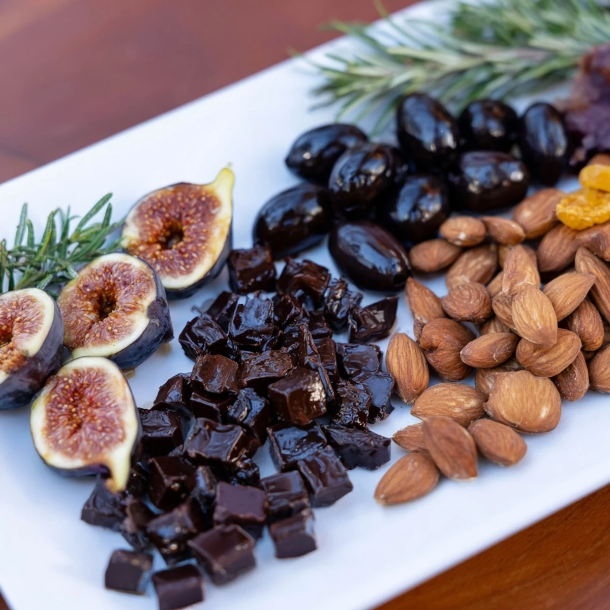 A beautifully arranged Winter Solstice Board with Brie, pears, and olives, ready to serve.