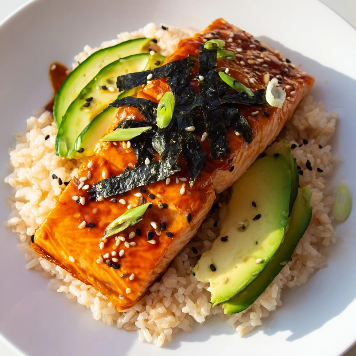 Delicious and flavorful, this Emily Mariko-Inspired Sticky Orange Gochujang Salmon Bowl is a delightful meal with every bite.