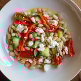 A close-up of the fresh and vibrant Mediterranean White Bean Salad, complete with crumbly feta.
