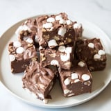 Rich, glistening chocolate 5-Minute Marshmallow Fudge squares, ready to be cut and served.