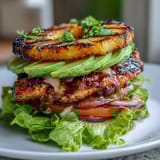 Grilled chicken pineapple burger stacks with juicy chicken, sweet pineapple, and crisp lettuce for a healthy, flavorful meal.  