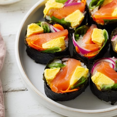 Vibrant High-Protein Sushi Wrap Smoked Salmon Holiday Roll, filled with fresh veggies and creamy cottage cheese.