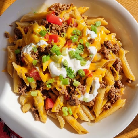 One-Pot Taco Pasta with melted cheese and fresh herbs, a comforting Tex-Mex family dinner.