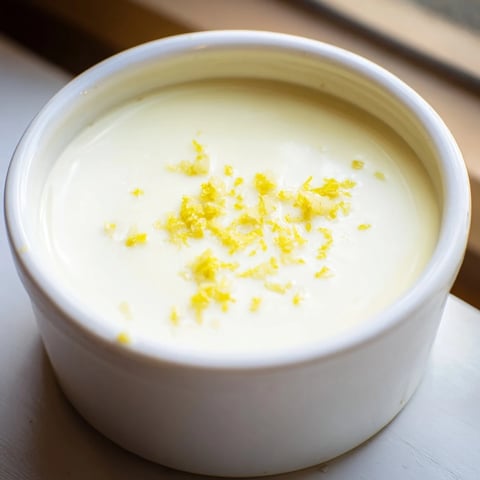 Creamy, set 3-Ingredient Lemon Posset, a British dessert with a bright lemon flavor, served cold.