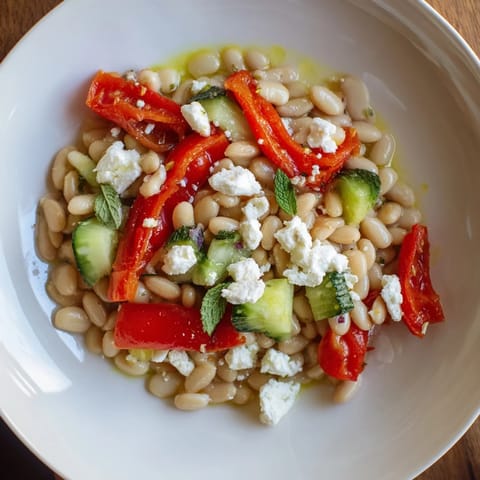 A close-up of the fresh and vibrant Mediterranean White Bean Salad, complete with crumbly feta.