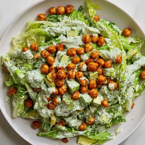 Vibrant Green Goddess Salad with chickpeas, perfectly crisp, served with a creamy herbed dressing.
