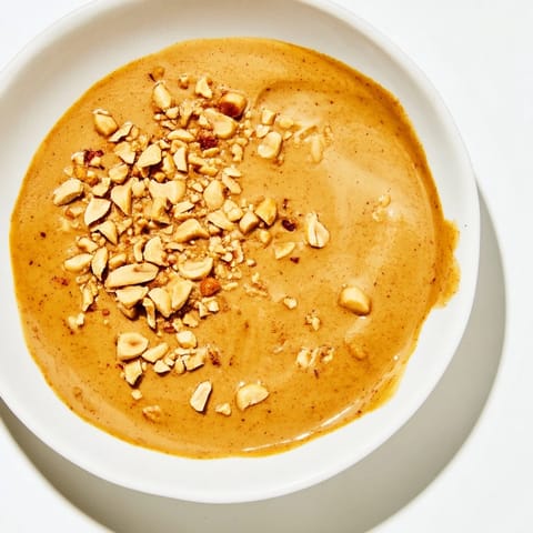 Thick and glistening Indonesian satay sauce, perfect for dipping, seasoned with lime and spices.