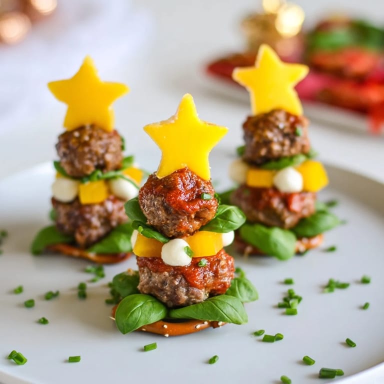 Imagine these flavorful Mini Meatball Christmas Trees: red tomatoes, creamy mozzarella, and delicious meatballs.