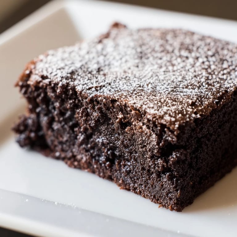 These rich Brownie Squares with their light powdered sugar topping look irresistibly soft, ready to be enjoyed.