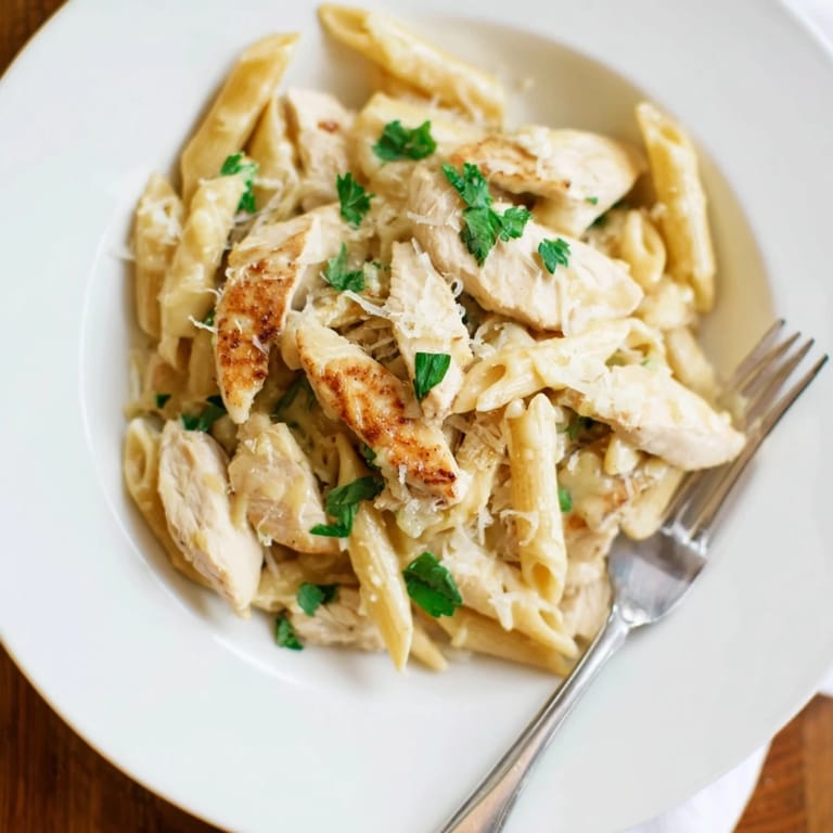 Honey Chipotle Chicken Pasta tossed with tender chicken and herbs in a skillet, ready to be served for dinner.